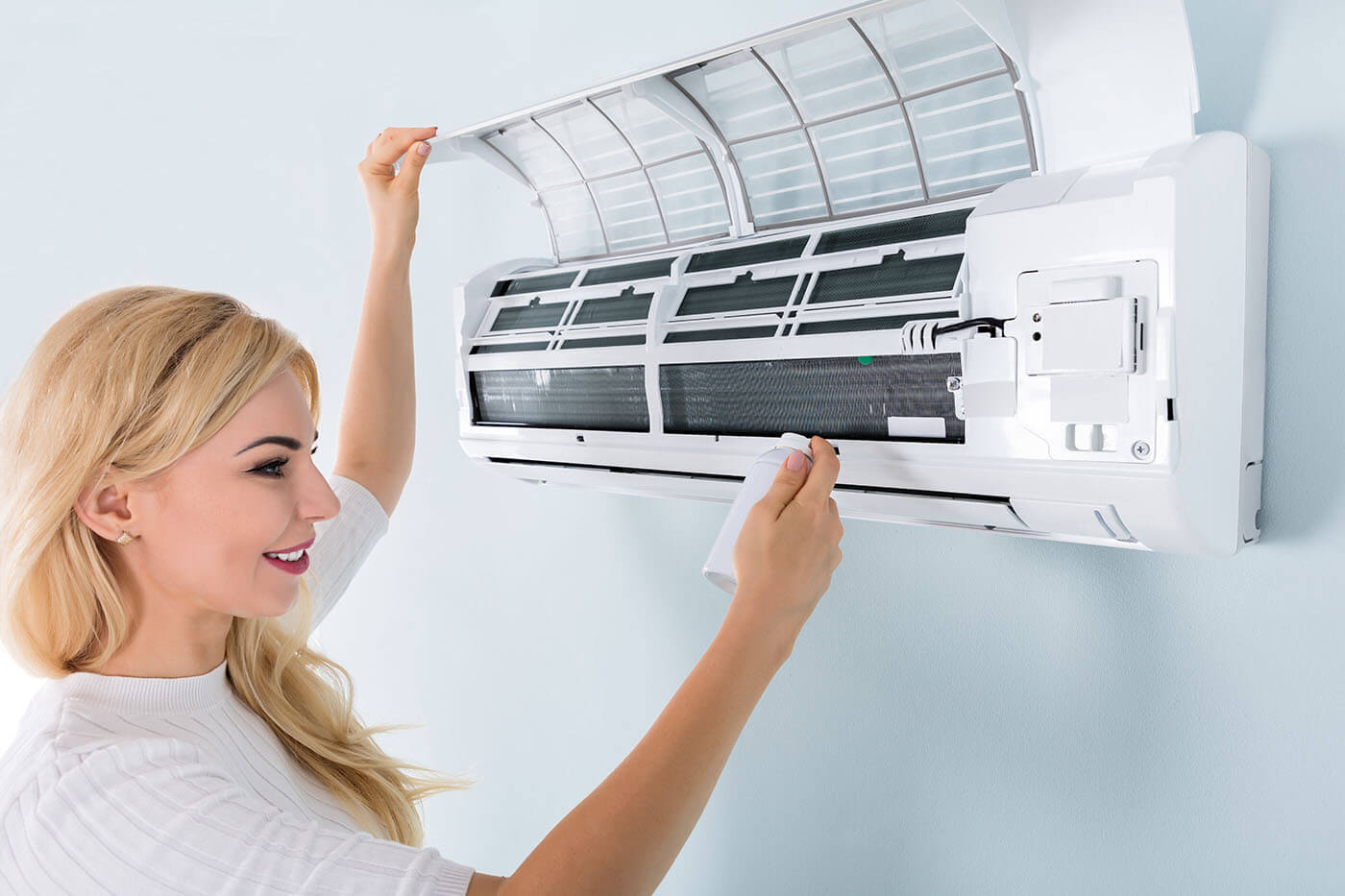 How often should an air conditioner be serviced?